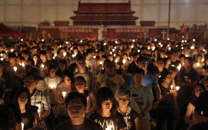 People attend a candlelight vigil at Victoria Park in Hong Kong in 2016 to commemorate victims of the 1989 military crackdown in Beijing. 