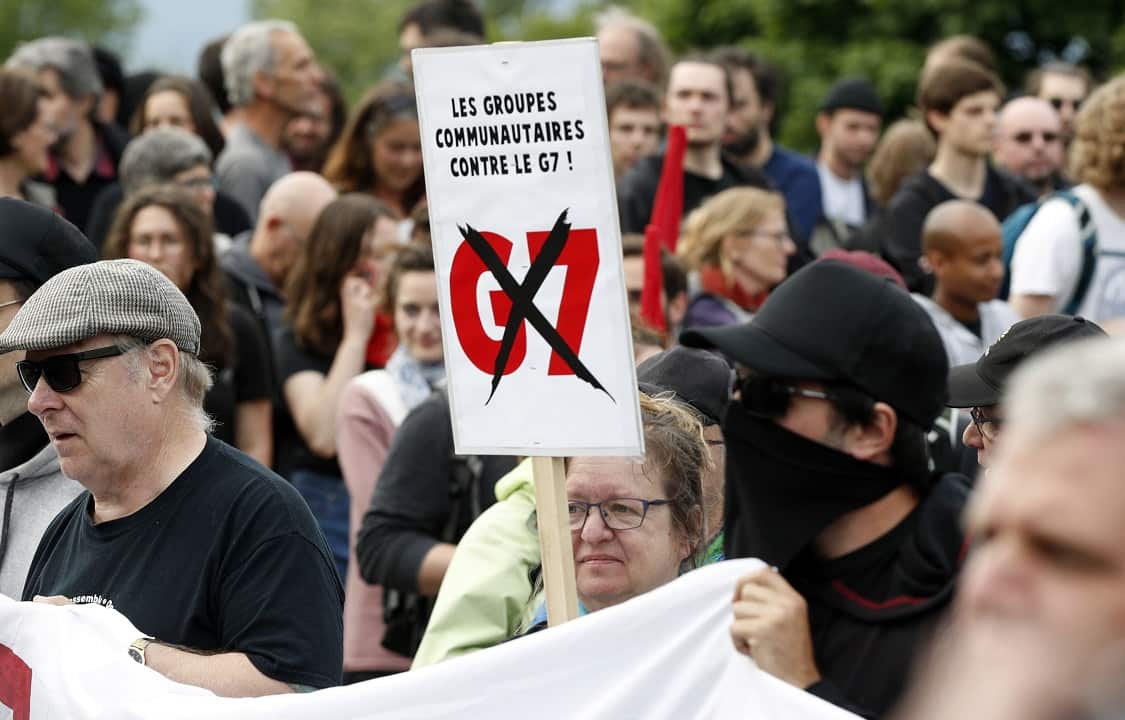 Protesters rally ahead of the G7 leaders' summit.