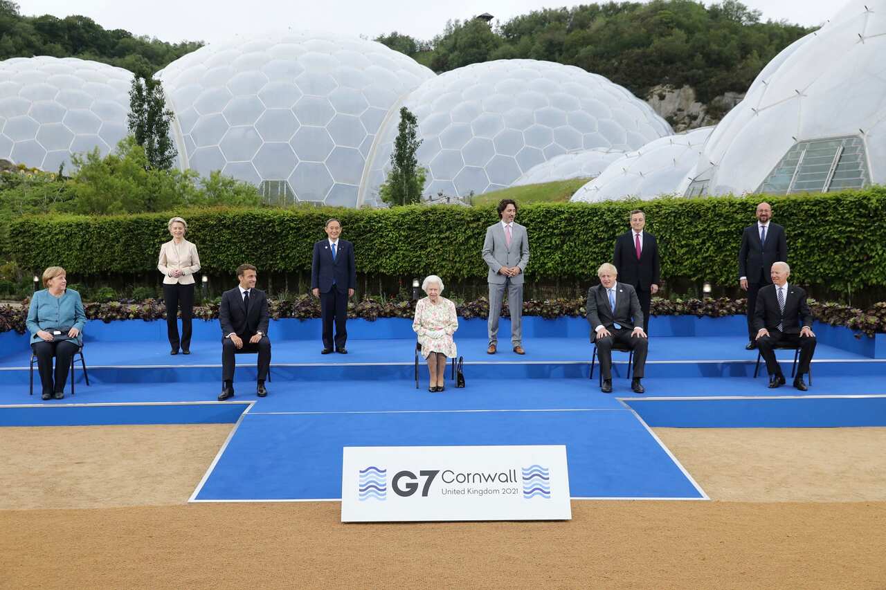 Britain's Queen Elizabeth II joins G7 leaders for a group photo.