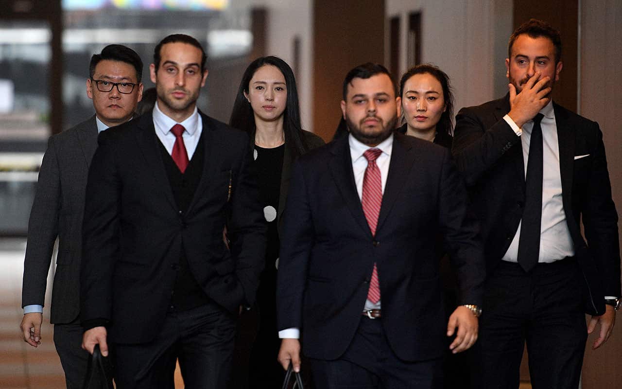 Xuan Dong (third left), the wife of Chinese actor Yunxiang Gao, leaves the NSW Supreme Court in Sydney, Friday, June 29, 2018. 
