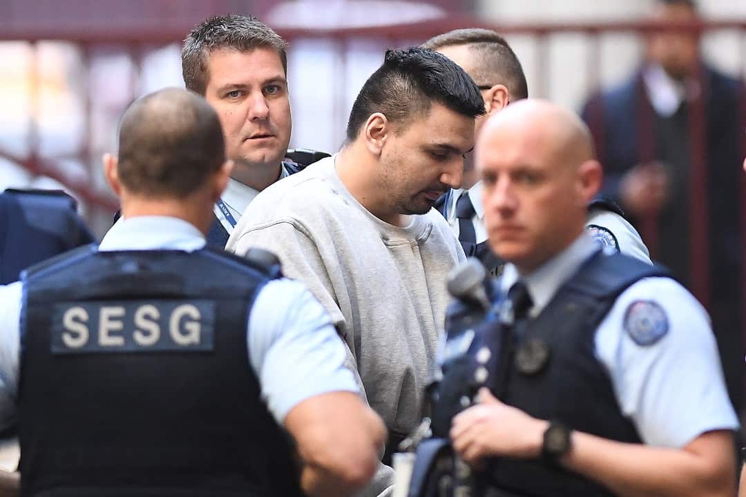 James Gargasoulas (centre) is transferred from a prison van at the Supreme Court in Melbourne, Tuesday, June 19, 2018. (AAP Image/Julian Smith) NO ARCHIVING