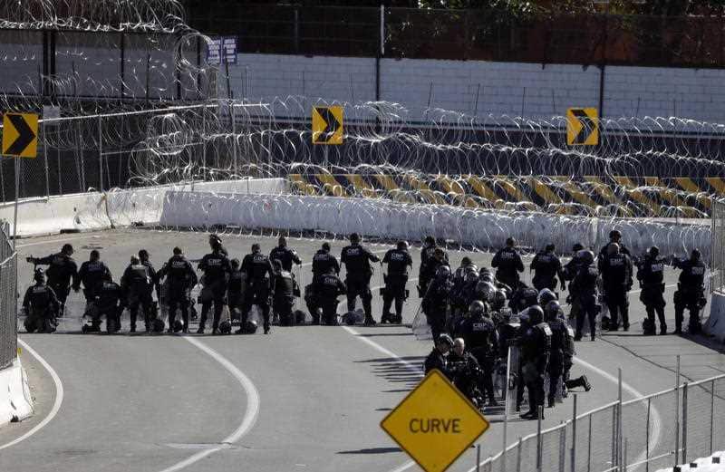 US Customs and Border Patrol officers form a line along the southbound lanes of the San Ysidro port of entry.