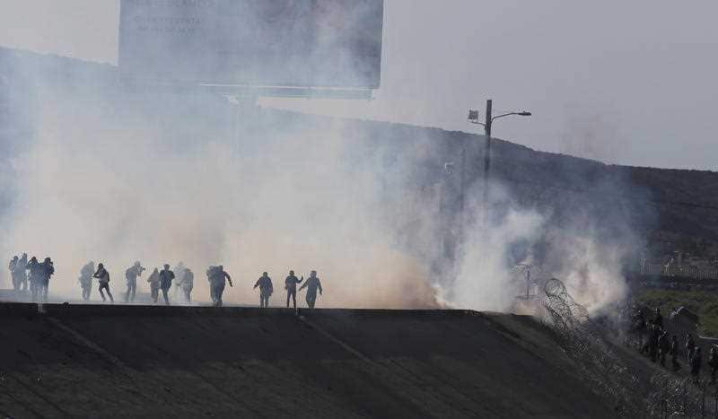 Tear gas fired by border police to prevent groups of people from crossing El Chaparral border crossing, in the city of Tijuana.
