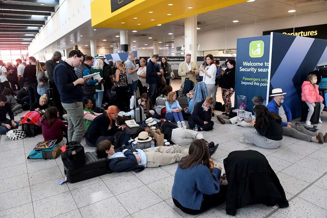 Passengers wait at Gatwick airport.
