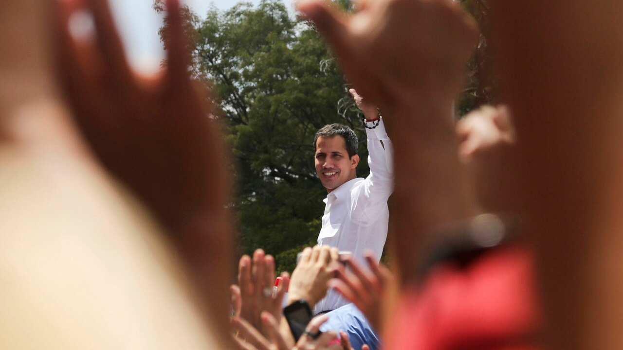 The leader of Venezuela's National Assembly Juan Guaido greets supporters.