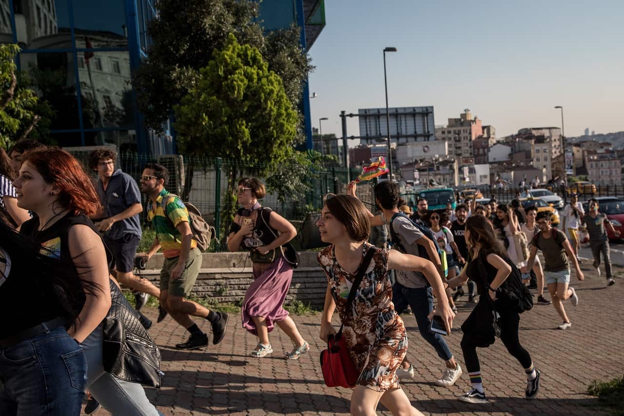 LGBTQI+ supporters dance and sing in the street on July 1, 2018 in Istanbul, Turkey. 