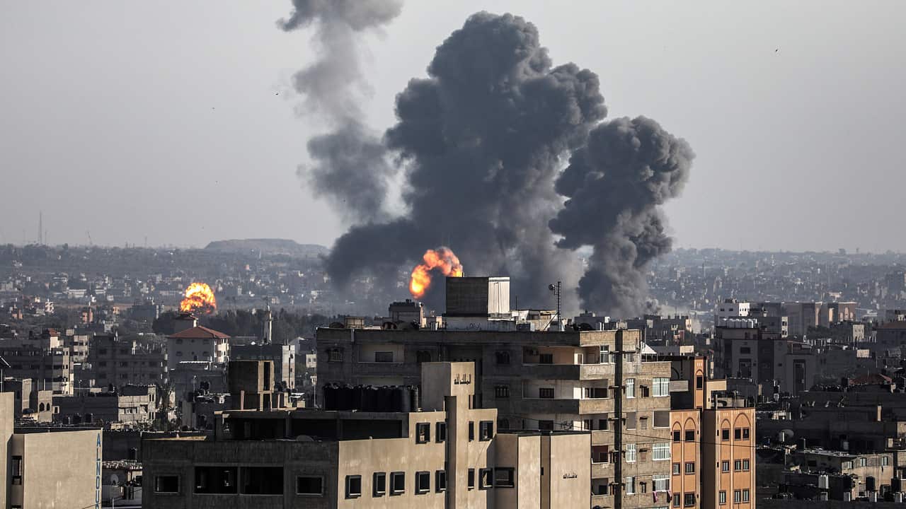 Smoke and flames rise after an Israeli airstrike in Gaza City.