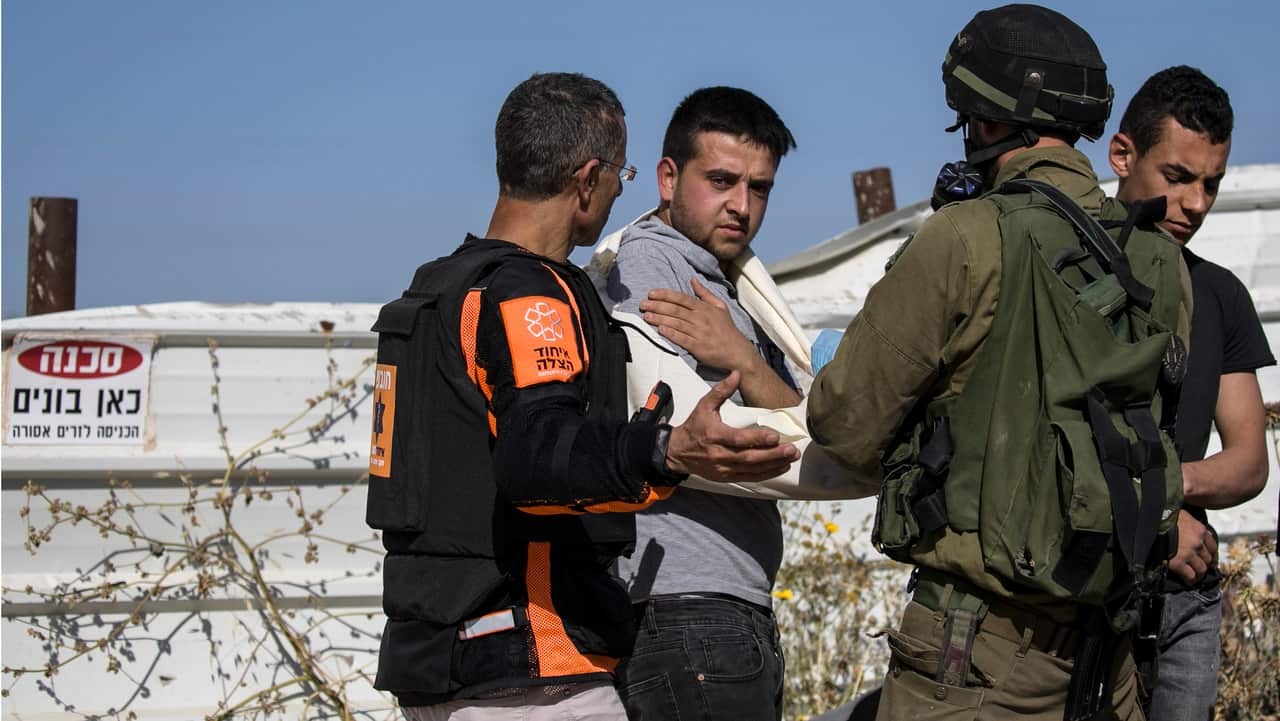 Illegal Palestinian workers from the West Bank, who were hiding at a construction site that was hit by a rocket from Gaza, are arrested by police.