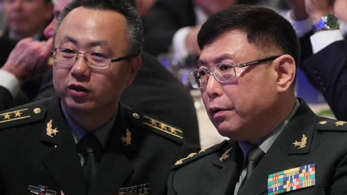 Vice President of the Academy of Military Science Lieutenant-General He Lei (R) of the People's Liberation Army.