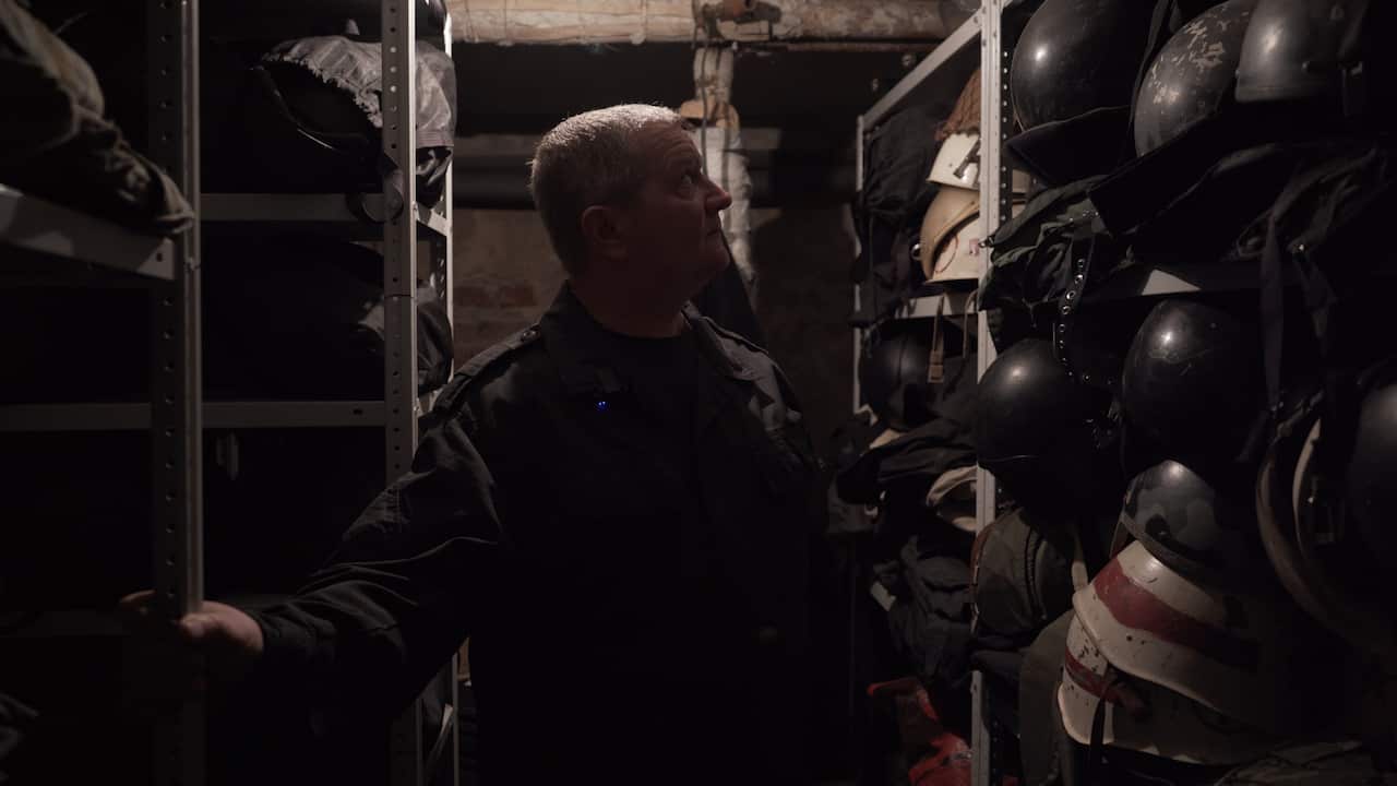 Kaskad leader Gennady Korotaev with stockpiles of weaponry and combat gear.