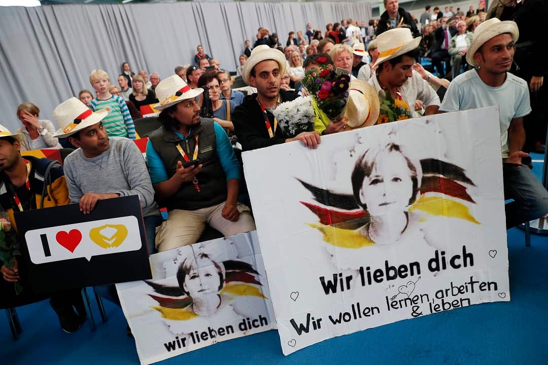 2017: A group of supporters hold placards of Chancellor Angela Merkel reading 'We love you'.