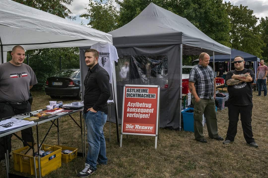 Vendors sell souvenirs at booths during the eighth annual Eichsfeld Day, organized by the National Democratic Party, a political party of avowed neo-Nazis, in Leinefelde, Germany.
