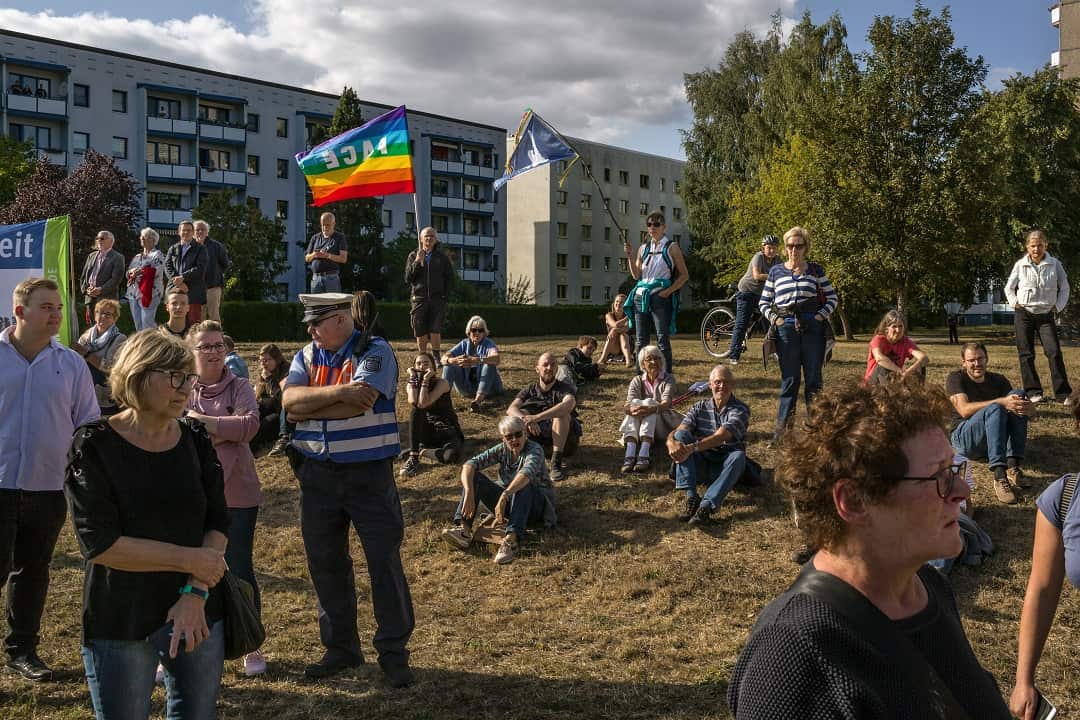Demonstrators gather in front of an apartment building just outside the eighth annual Eichsfeld Day.