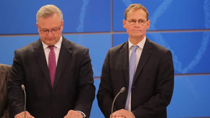 Christian Democrats candidate Frank Henkel and Social Democrat candidate Michael Mueller after state elections in Berlin.