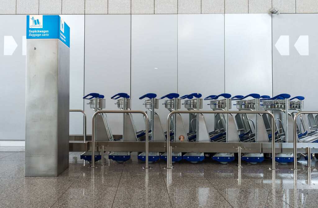 Baggage carts are standing up in Terminal 2 of Frankfurt Airport. 