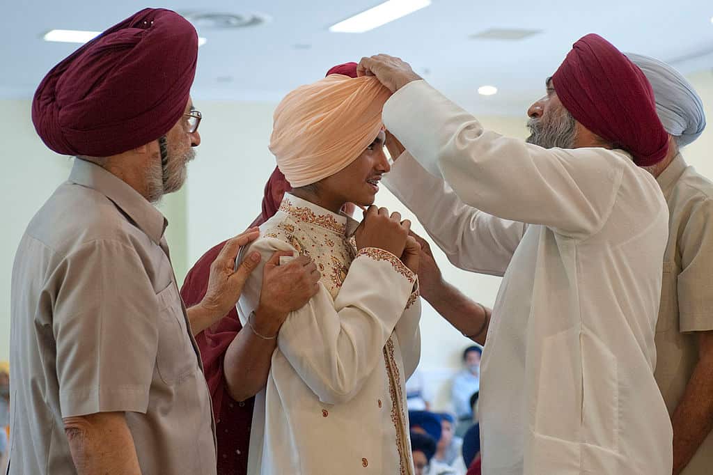 Boy participating in his Dastar Bandi a ceremony unique in the Sikh community where a young male decides to start wearing a turban.