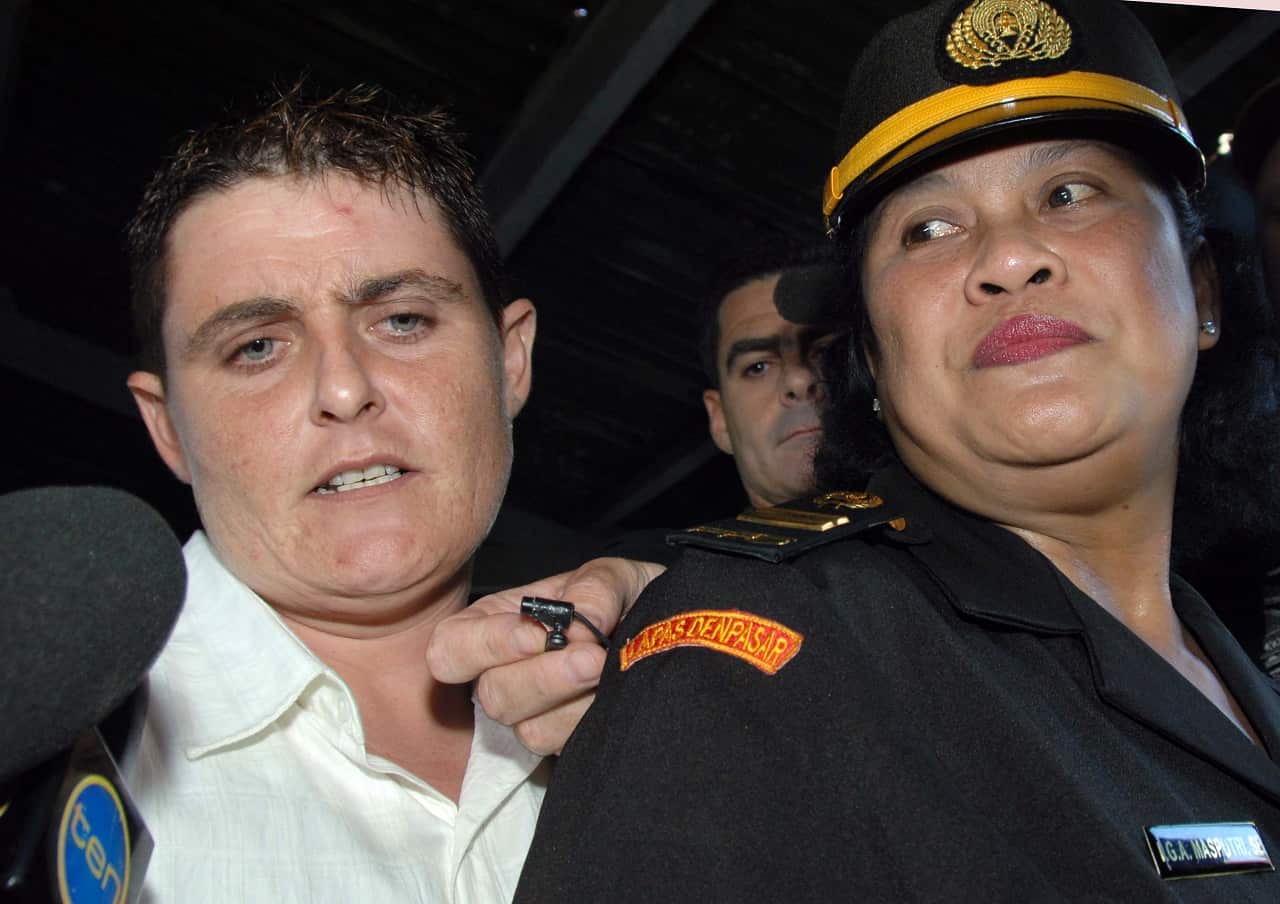 Convicted drug smuggler Renae Lawrence with an Indonesian prison official during her trial.