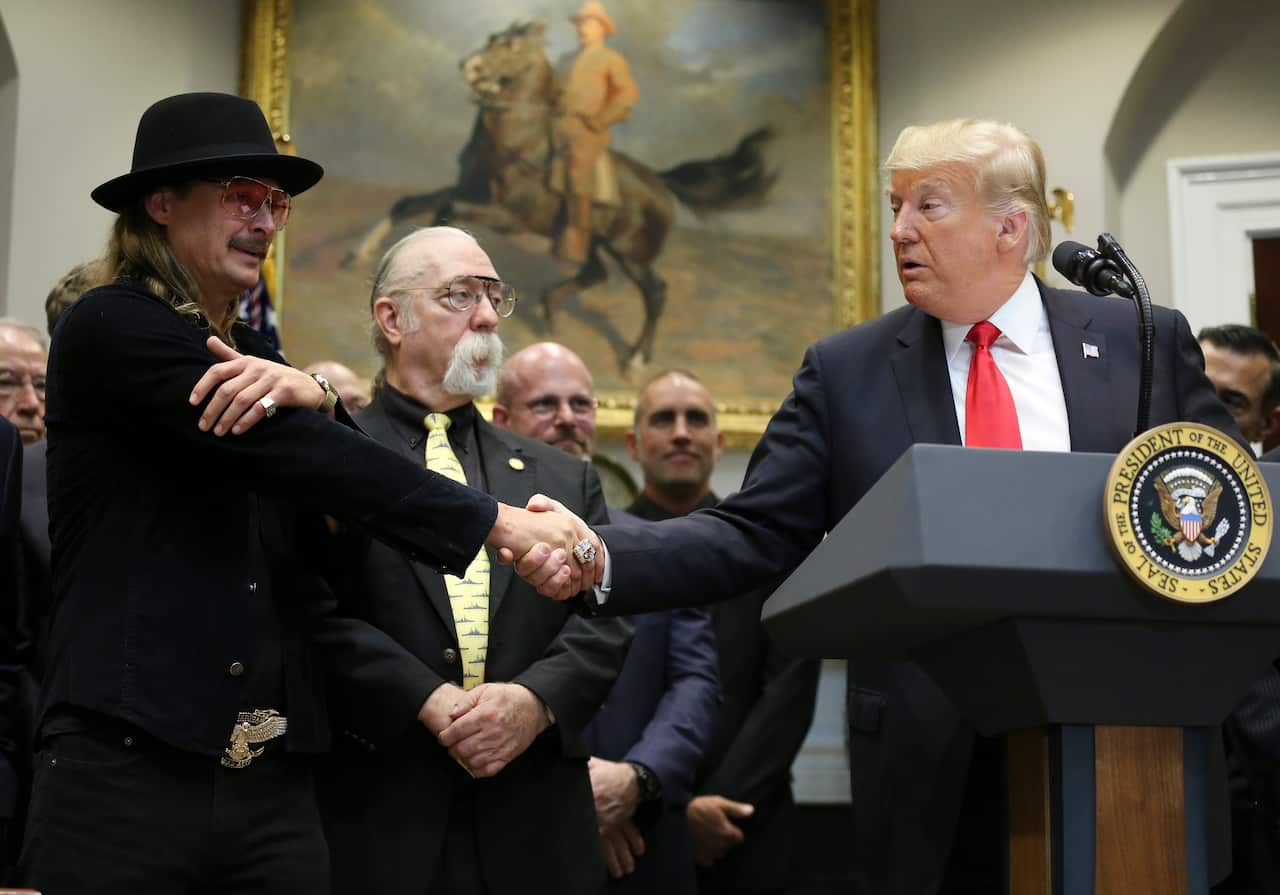 U.S. President Donald Trump shakes hands with Kid Rock prior signing a H.R. 1551, the 'Orrin G. Hatch-Bob Goodlatte Music Modernization Act'.