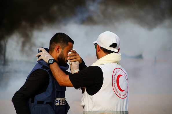 Palestinian medic Ahmed Abu Foul seen helping a journalist