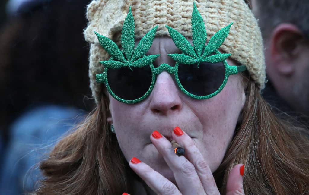 People gather for a 420 celebration of legalisation of marijuana in Toronto.