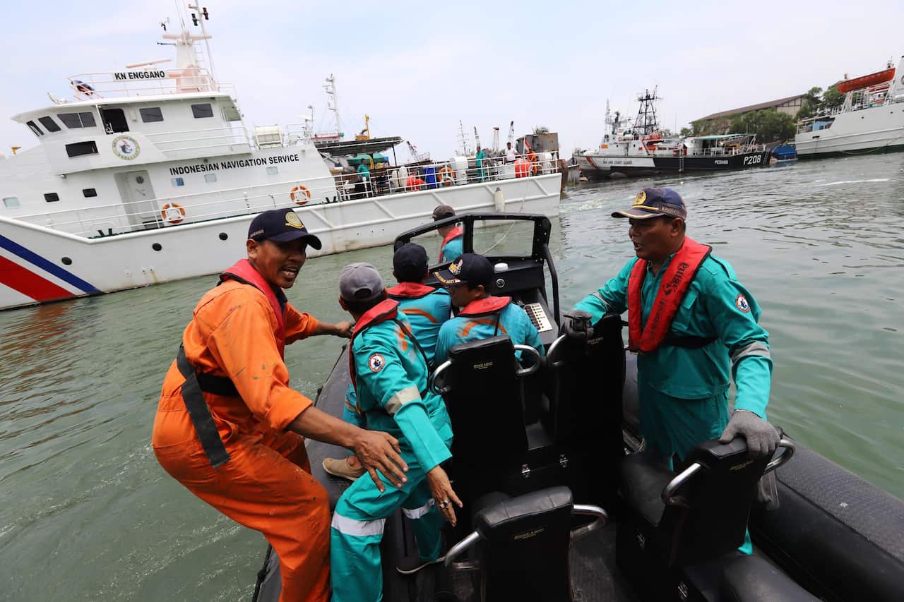 Rescue teams search for survivors from the Lion Air flight JT 610.
