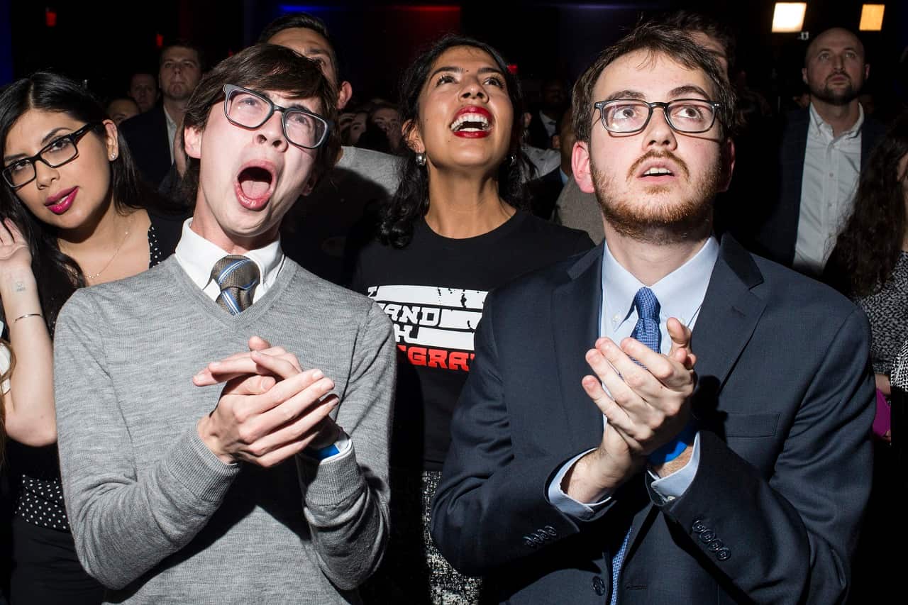 People react to midterm election results during a DCCC election watch party.