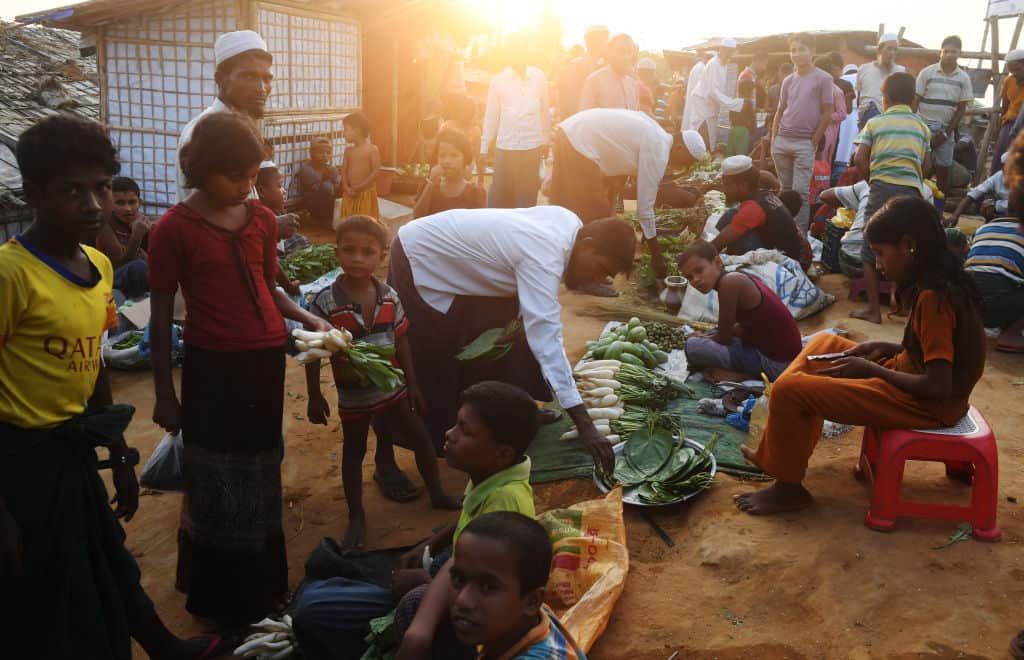 Rohingya refugees bargain for items at the Hakimpara refugee camp in Bangladesh's Cox's Bazar district