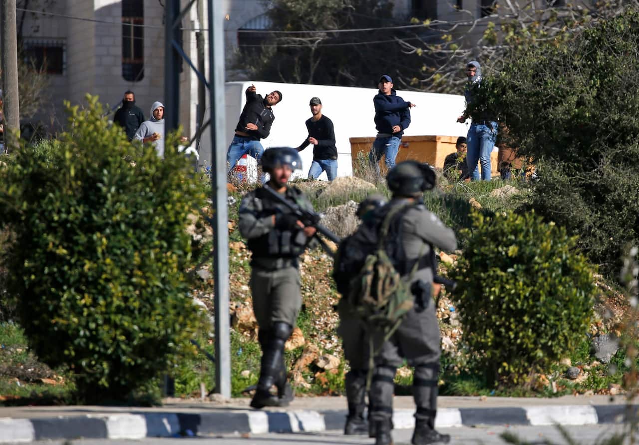 Israeli soldiers deploy during clashes in the West Bank city of Ramallah following a raid on December 10, 2018, one day after a drive-by shooting attack next to a settlement which many Israelis were injured.