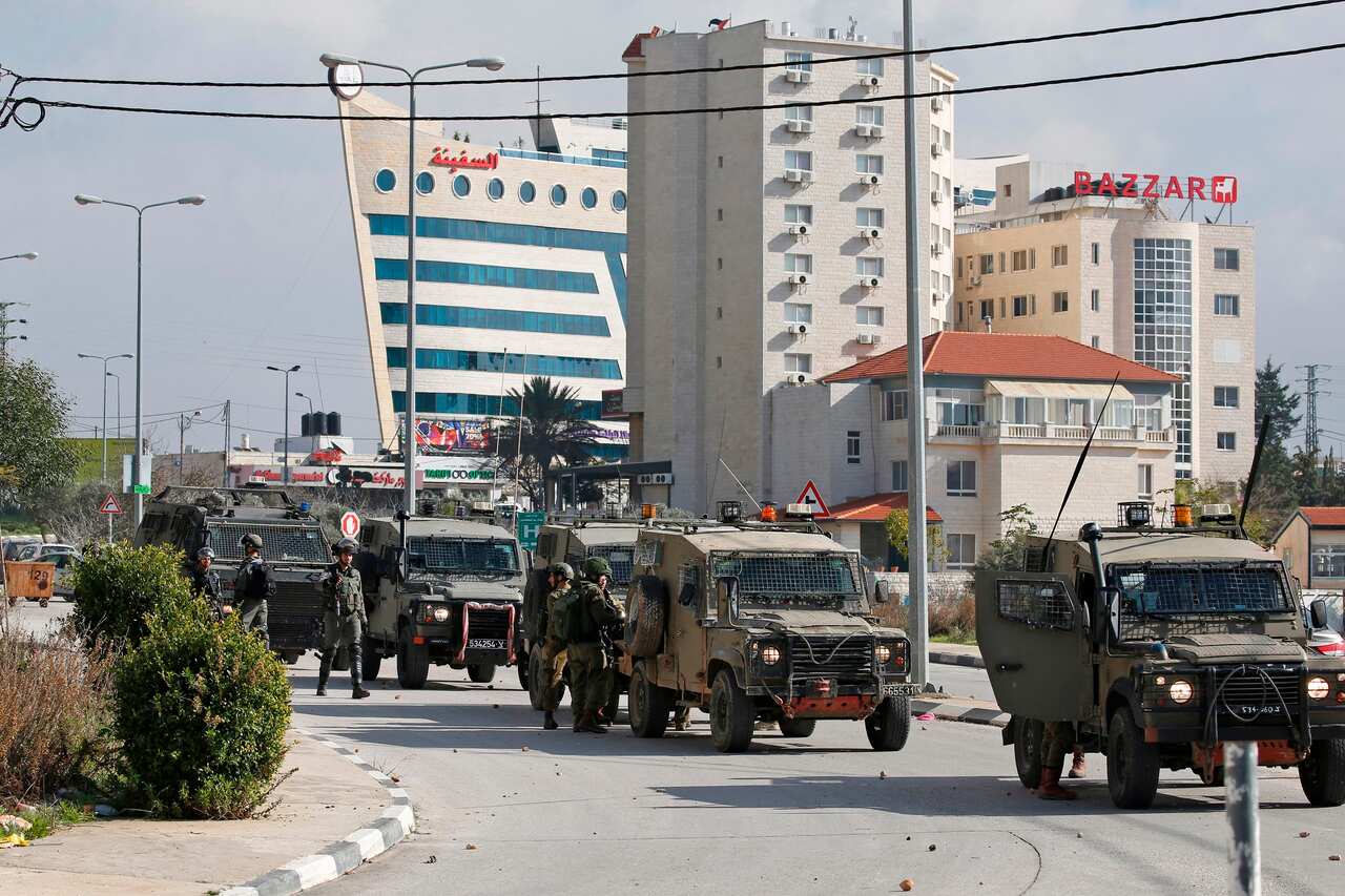 Israeli soldiers deploy during clashes in the West Bank city of Ramallah following a raid on December 10, 2018, one day after a drive-by shooting attack next to a settlement which many Israelis were injured.
