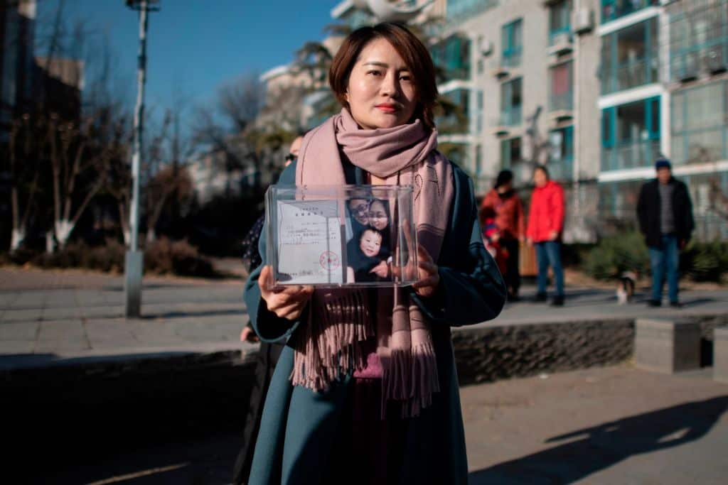 Li Wenzu poses for the media before shaving her head to protest the detention of her husband and Chinese human rights lawyer Wang Quanzhang, detained during the 709 crackdown, in Beijing on December 17, 2018.