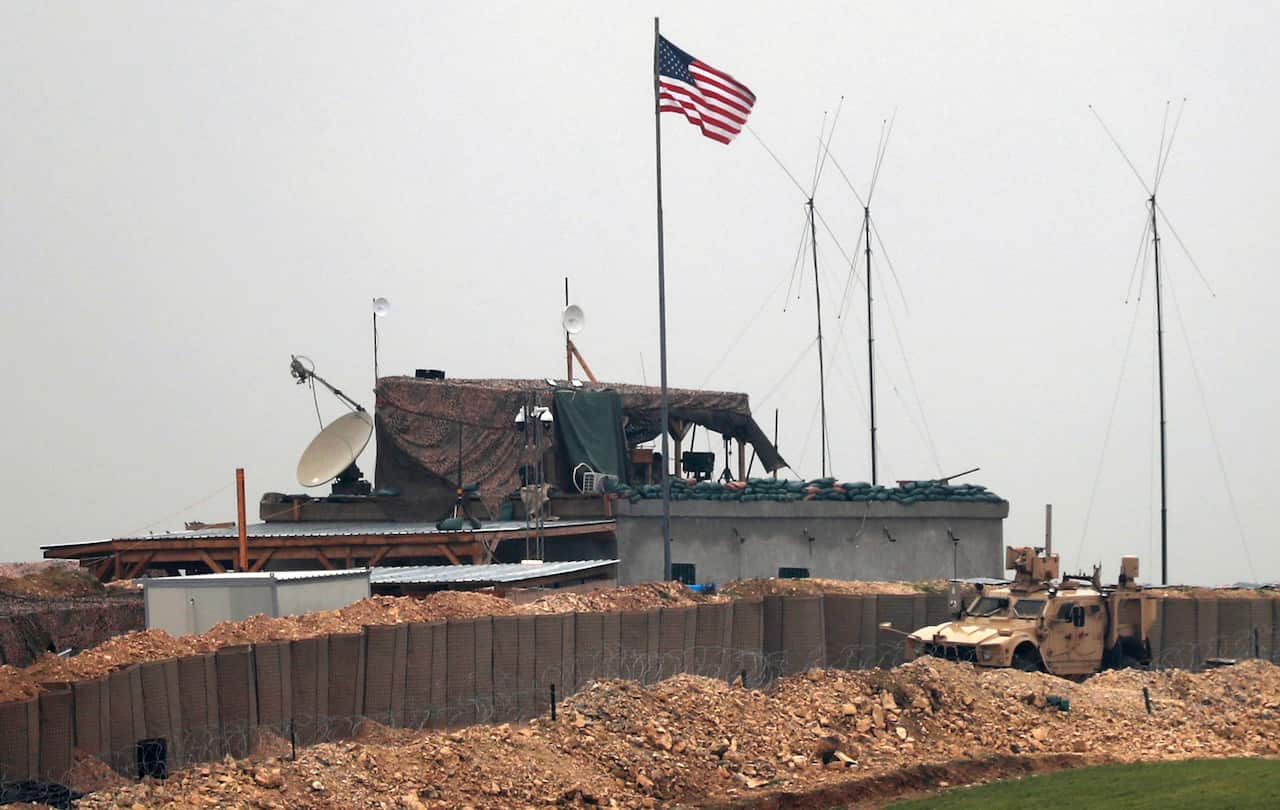 US forces vehicles and structures are seen on the outskirts of the northern Syrian town of Manbij in the village of Dadat.