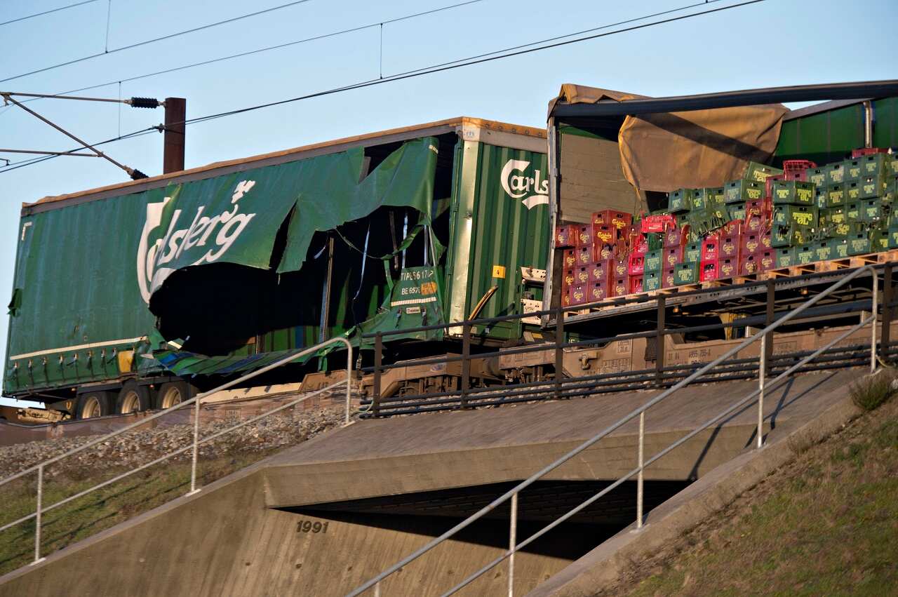Damaged containers on a cargo train are seen on the Great Belt Bridge.