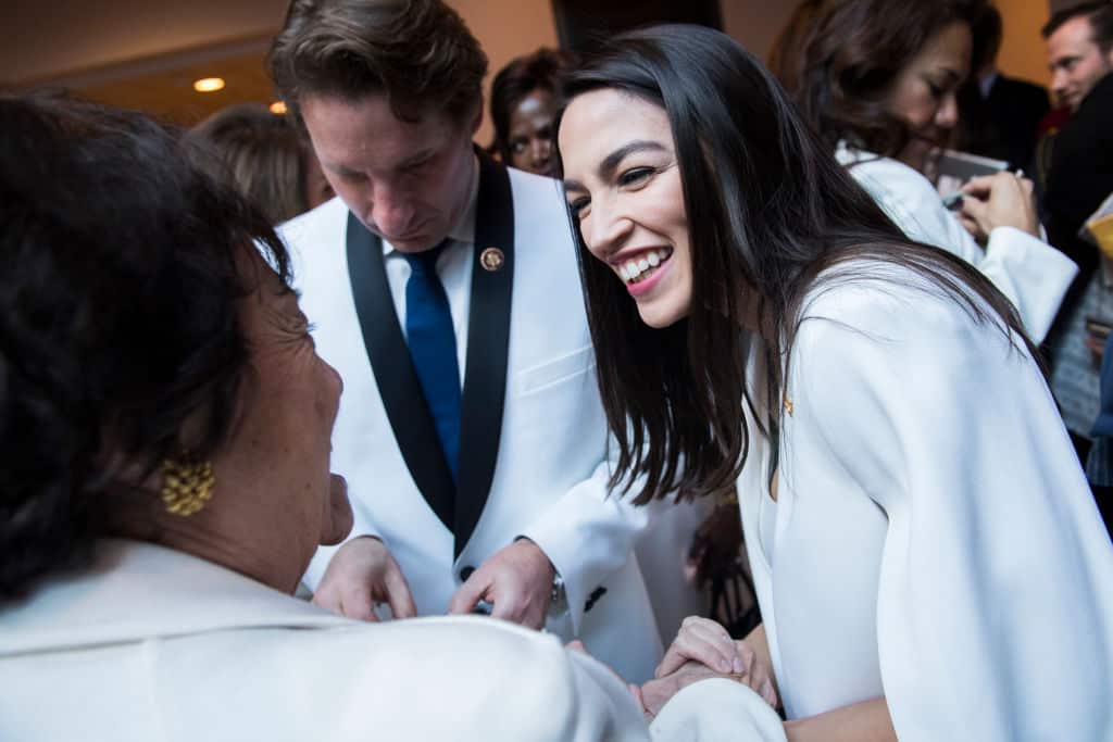 Alexandria Ocasio-Cortez and Dean Phillips in white.