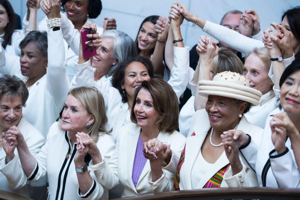 Democrats in the Capitol Visitor Center wear "suffragette white" to the State of the Union address to show solidarity for women's agendas.
