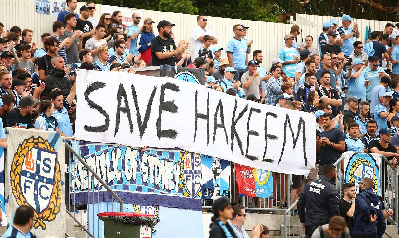 Sydney FC fans display a sign during an A-League match.