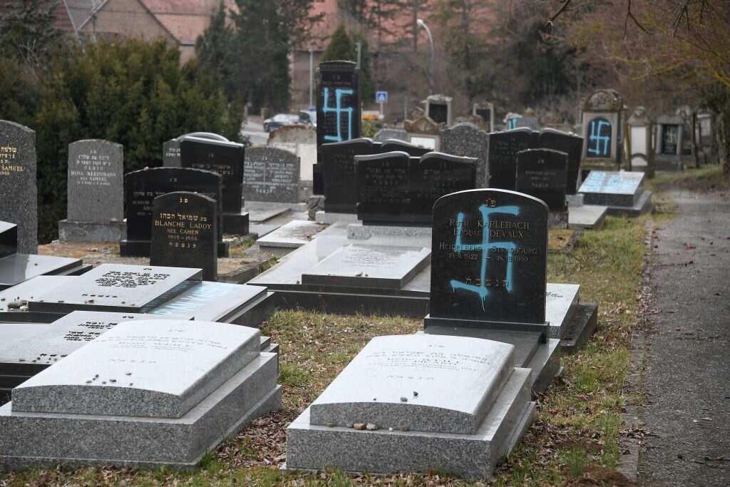 The cemetery was vandalised just hours before the march against anti-Semitism started.