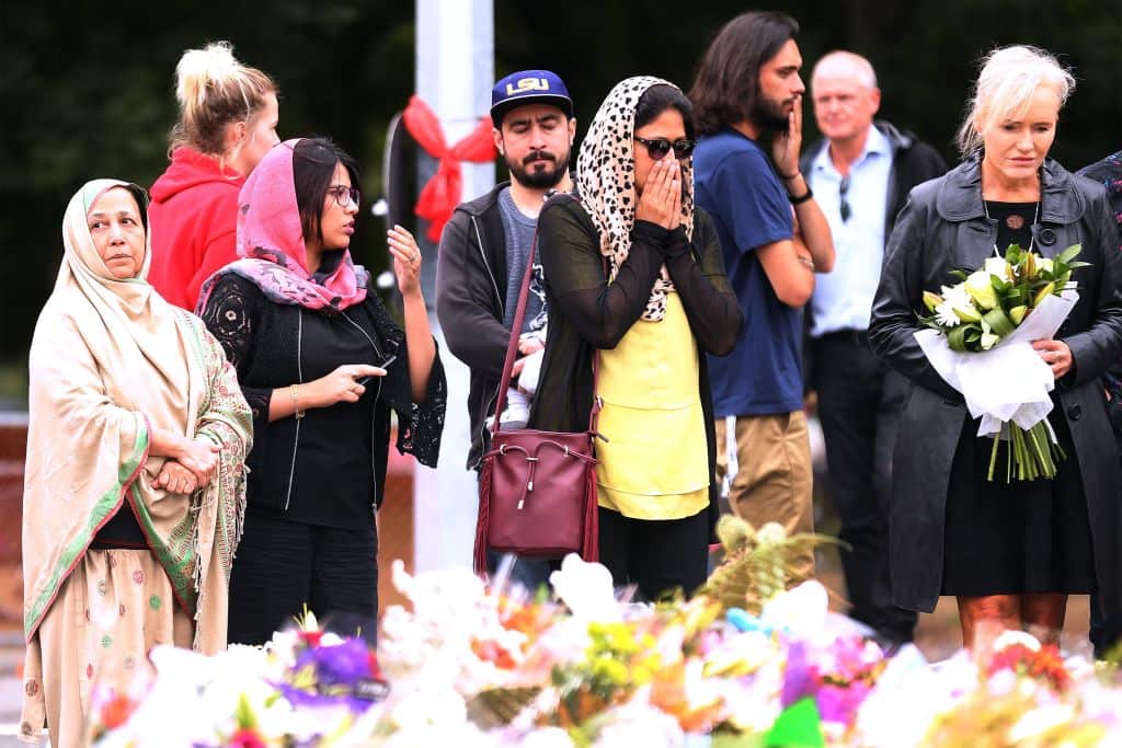 People gather near the Al Noor mosque in Christchurch to pay their respects.