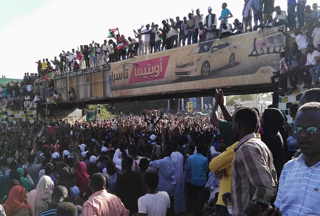 Sudanese protesters gather outside the military headquarters.