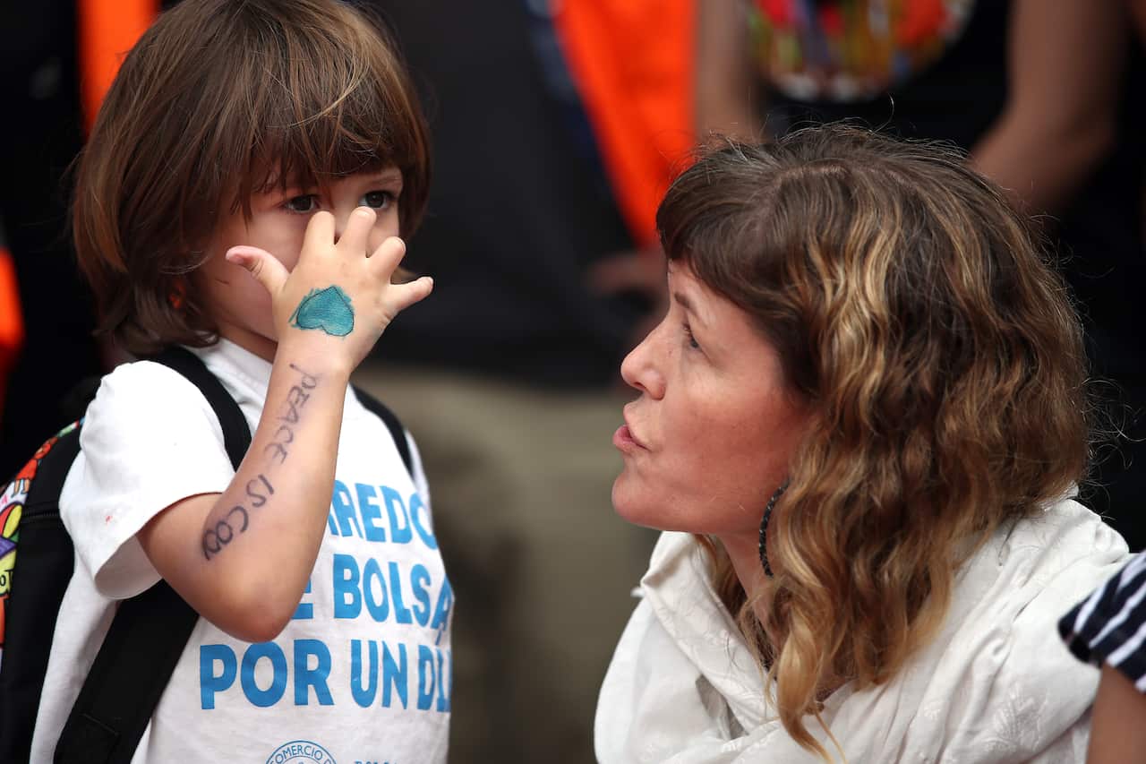 People gather to march against racism in Auckland, New Zealand.