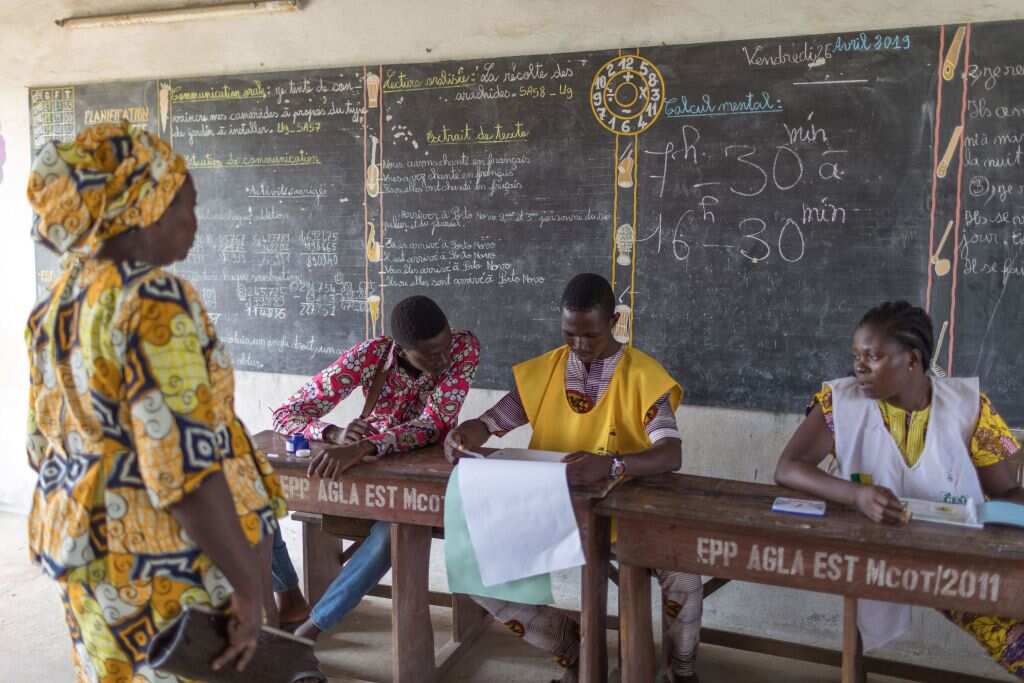 A woman arrives to vote at the Agla East State primary school in Cotonou on April 28, 2019, as the nation goes to the polls