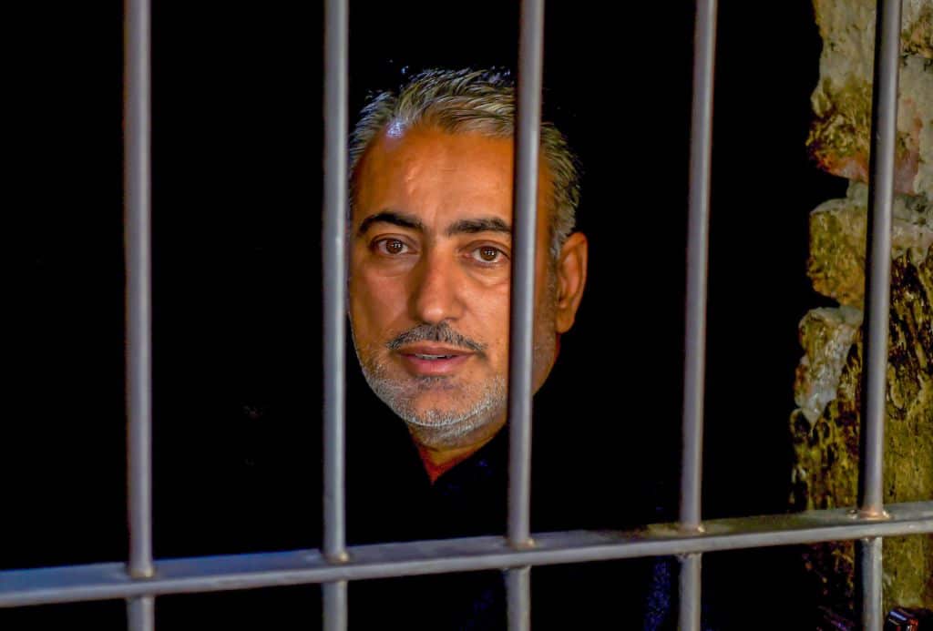 A local pediatrician alleged to have been responsible for the HIV outbreak is seen behind the bars.