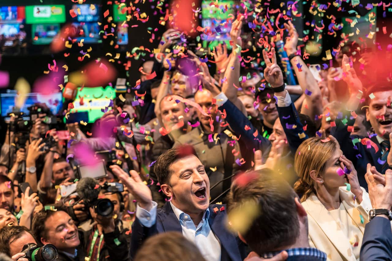 Volodymyr Zelenskiy celebrates his apparent victory in Ukraine's presidential race at his election-day headquarters after polls closed on April 21, 2019.