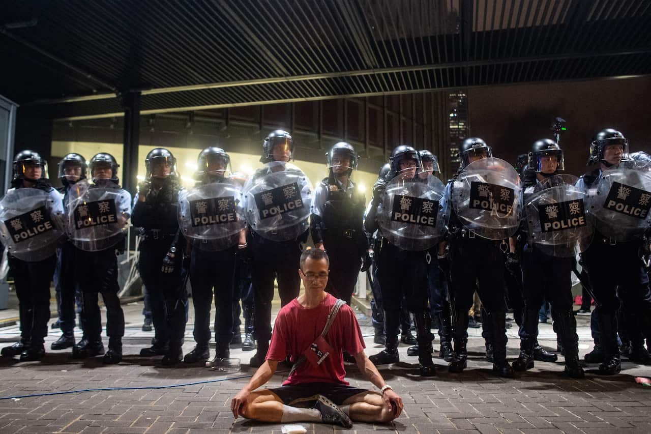 Police gather at a rally against a controversial extradition law proposal in Hong Kong.