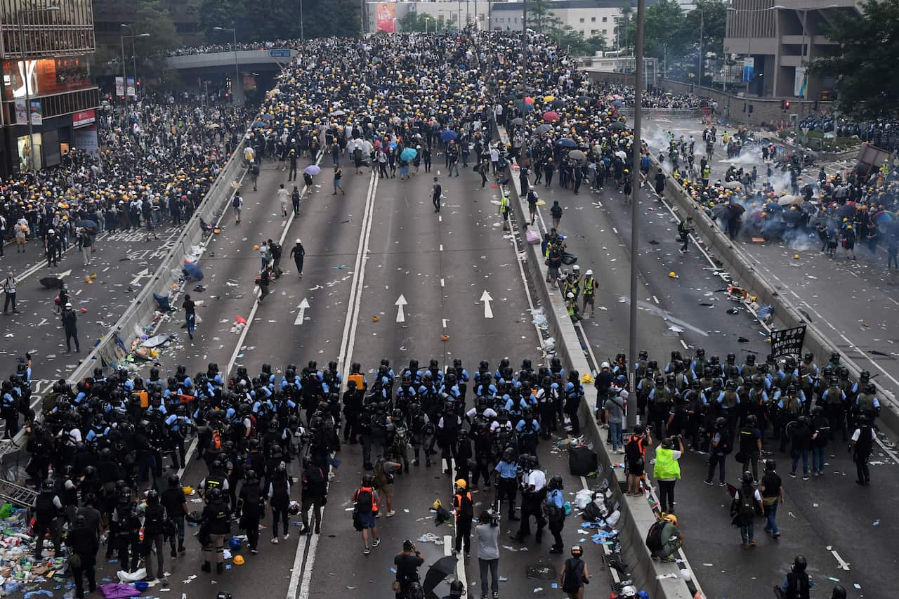 Protesters face off with police during a rall outside the government headquarters in Hong Kong.