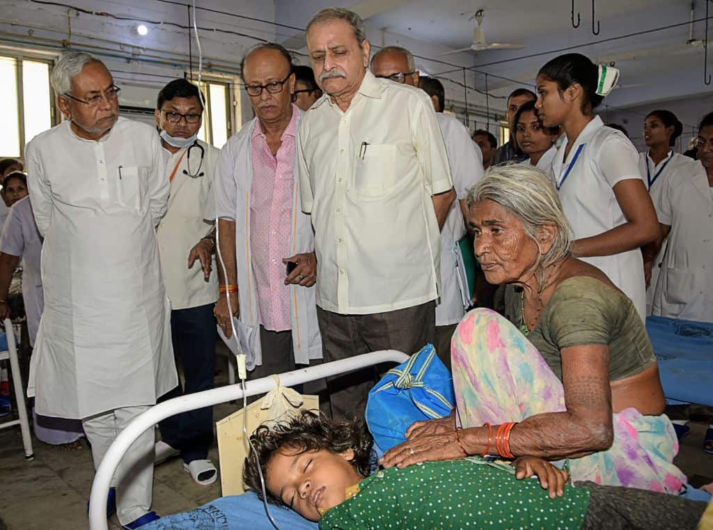 Bihar Chief Minister Nitish Kumar (L) visits a hospital as more than 150 children lost their life due Acute Encephalitis Syndrome.