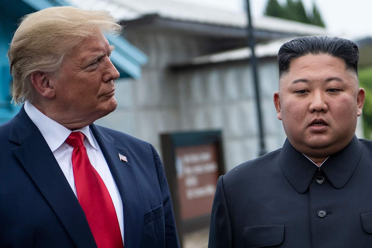 US President Donald Trump and North Korea's leader Kim Jong-un talk before a meeting in the Demilitarized Zone.