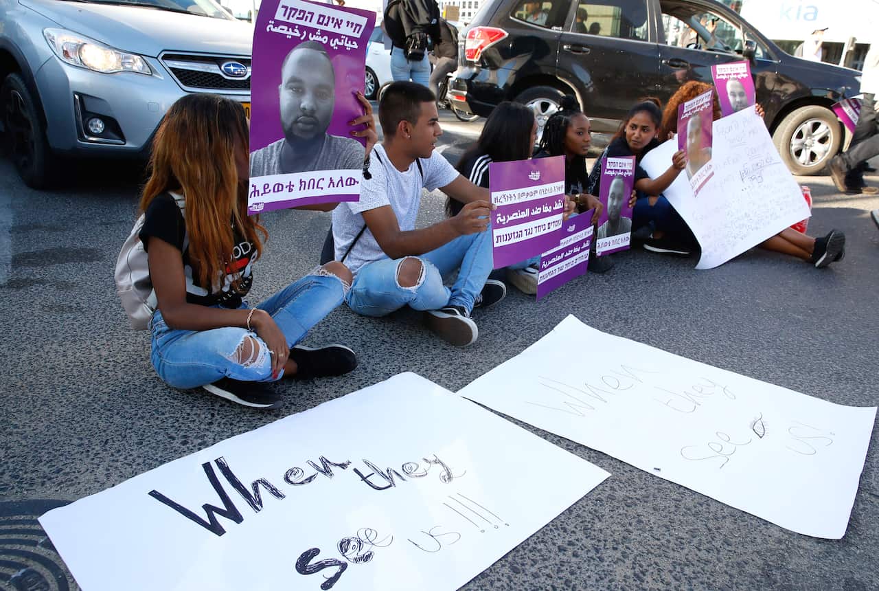 Demonstrators protest the killing of Solomon Tekah.