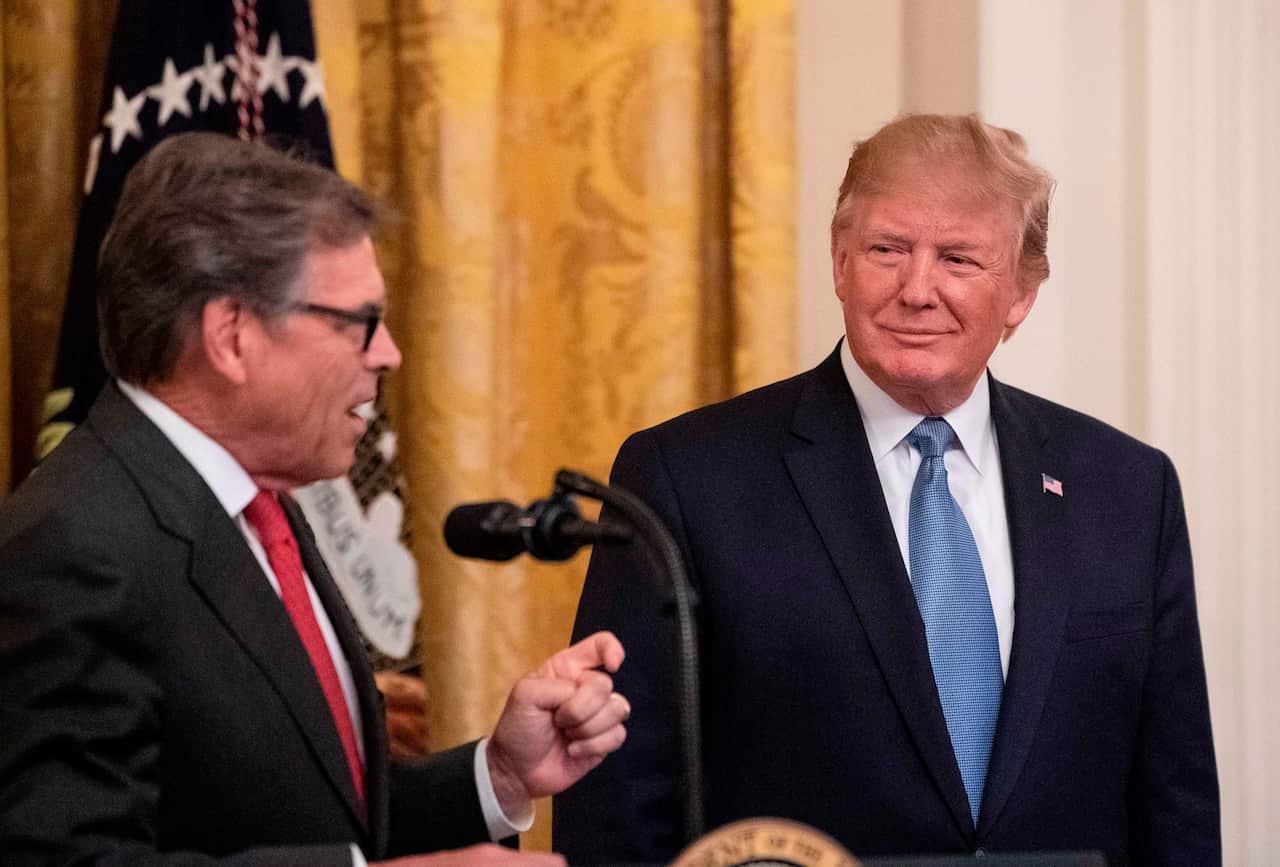 US President Donald Trump listens as Energy Secretary Rick Perry speaks about the administration's environmental policies.