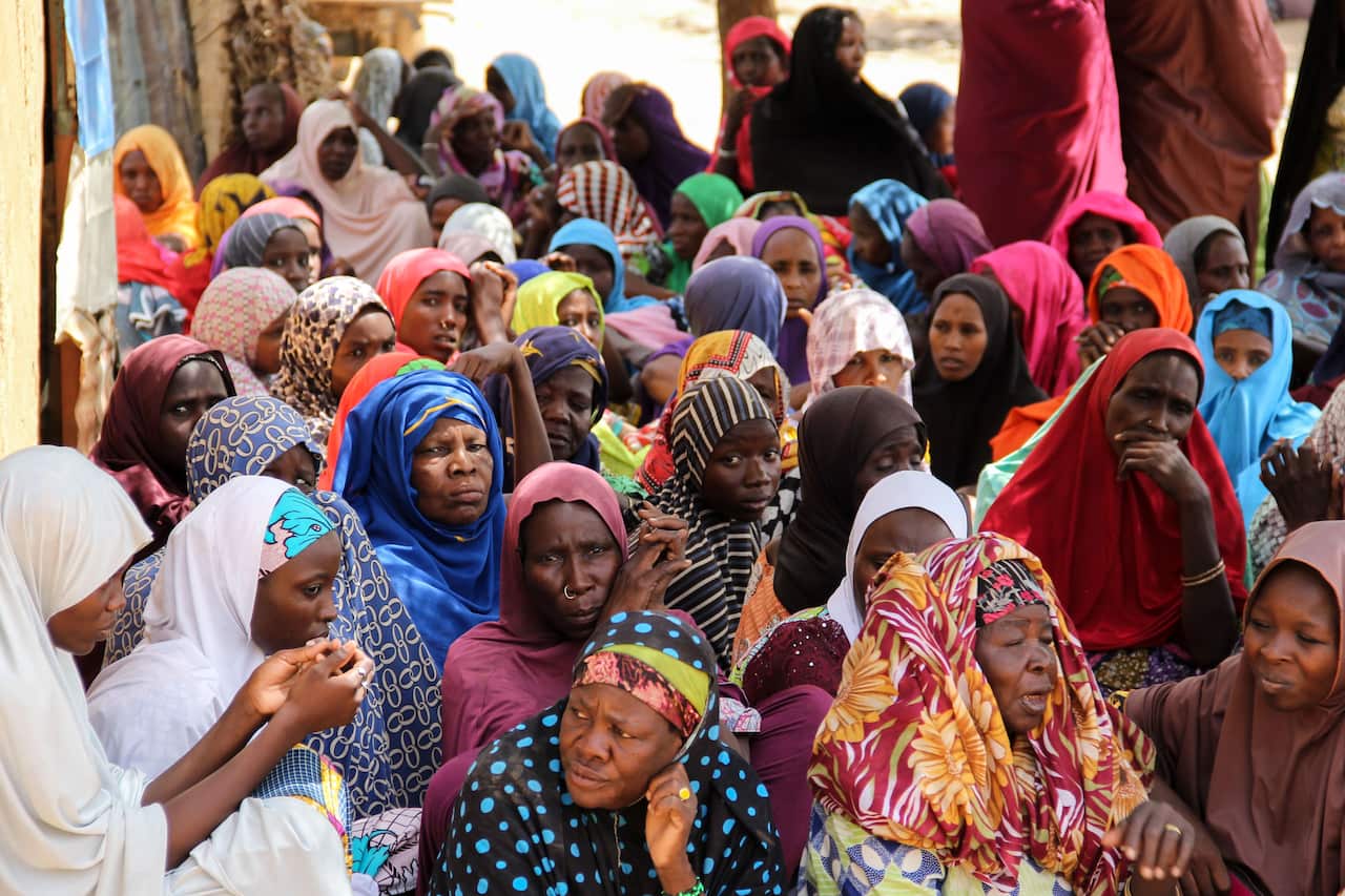Women gather during a burial ceremony, after two people were killed by Boko Haram fighters in Dalori camp for internally displaced people, near Maiduguri.