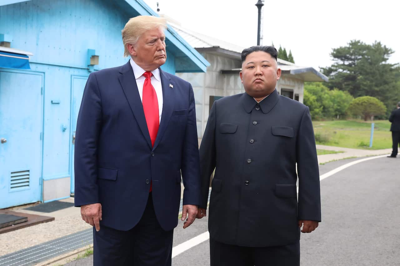 North Korean leader Kim Jong Un and U.S. President Donald Trump inside the demilitarized zone (DMZ) separating the South and North Korea.